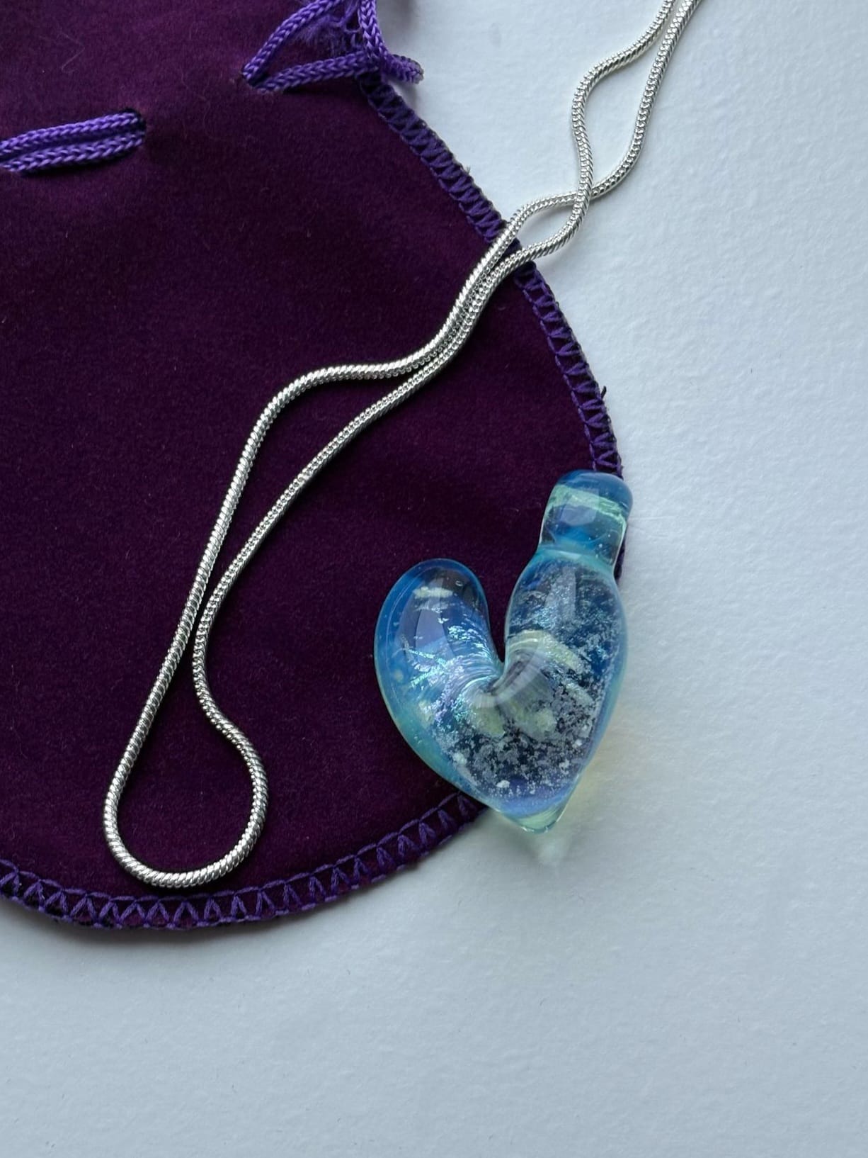 Blue vortex heart pendant