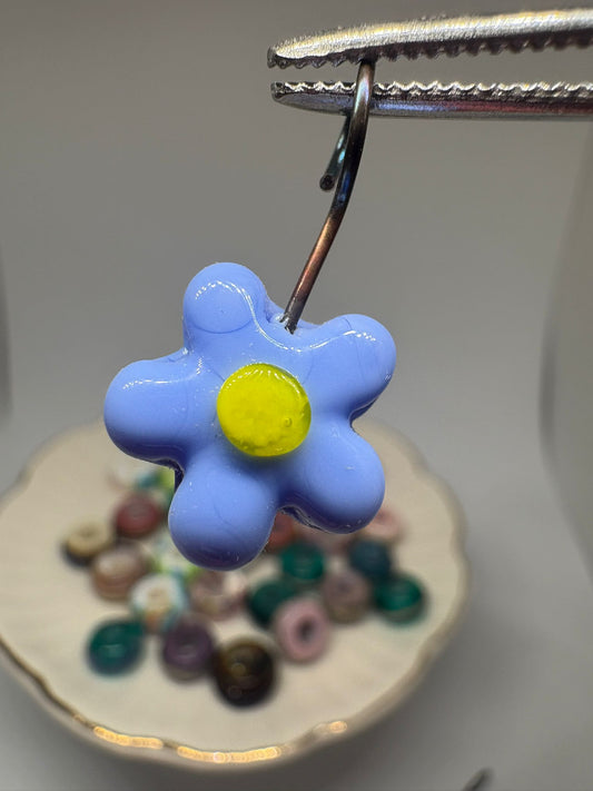 Blue glass daisy charm